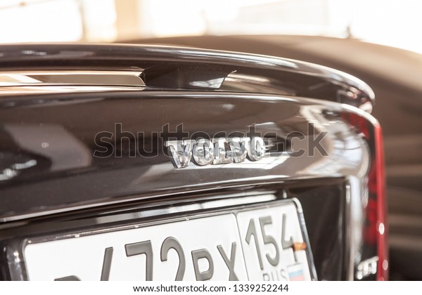 Novosibirsk, Russia - 08.01.18: Rear spoiler on\
the trunk of black used Volvo S60 car stands in the auto sale after\
wadhing