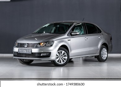 Novosibirsk/ Russia – April 02, 2020: silver Volkswagen Polo ,compact sedan  car parked outdoors on black background , front view