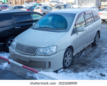 Novosibirsk, Russia - April 02 2020: Private White Metallic Color Japanese Family Station Wagon Classic Car Autech Nissan Liberty Rider, Old 90s 2000s Minivan Made In Japan On The Winter Urban Street