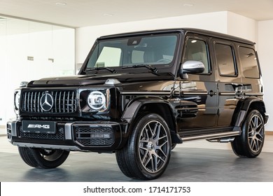 Novosibirsk/ Russia – April 02 2020:Mercedes-AMG G 63 , off-road car, side view. New black  modern   geep on a parking on  light background