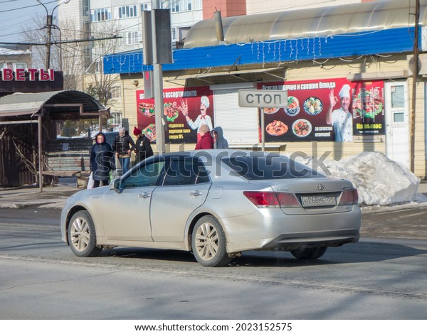 Novosibirsk, Russia - April 02 2021: private
silver gray metallic new luxury premium japanese AWD 4WD 4x4 all
wheel drive car Toyota Crown Athlete Hybrid (S210), sport sedan on
urban dirty city
street