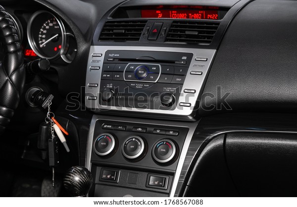 Novosibirsk/\
Russia – April 11 2020: Mazda 6, close-up of the central control\
panel, monitor with music and radio , adjustment of the blower, air\
conditioner, player. modern car\
interior\
