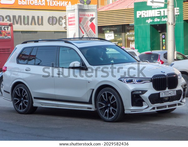 Novosibirsk, Russia -  april 12 2021: private
all-wheel drive white color germany crossover BMW X7 G07 xDrive30d
M Performance Accessories, M Sport Package tuned luxury 4wd SUV car
made in Germany