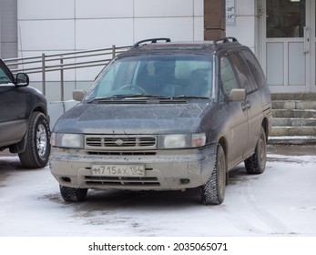 Novosibirsk, Russia, April 19 2021: Private Dark Gray Metallic Color Mpv Passenger Japanese Minivan Car Nissan Prarie Joy, Station Wagon Van Made In Japan Parking On Snow Frosty Urban Winter Street