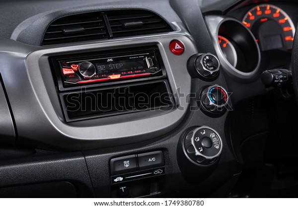 Novosibirsk/\
Russia – April 22, 2020: Honda Fit ,close-up of the central control\
panel, monitor with music and radio , adjustment of the blower, air\
conditioner, player. modern car\
interior\
