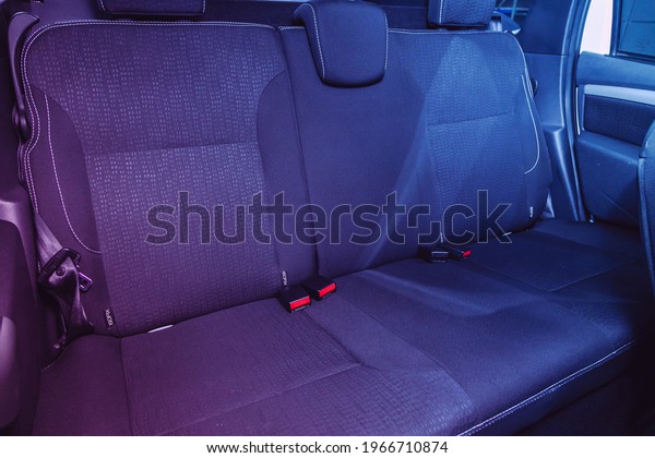Novosibirsk,
Russia – April 25 2021: Nissan Terrano, rear passenger seats in
comfort car under pink neon
light


