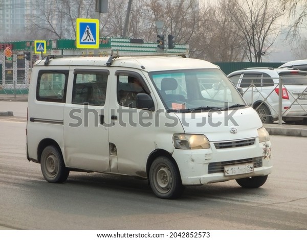 Novosibirsk, Russia, april 27 2021: white color
japanese station wagon courier delivery shipping car basic cheap
van Toyota Lite Ace (Town Ace) GL, local small cargo vehicle drive
on urban city
street
