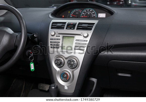 Novosibirsk/ Russia – April 28, 2020: Toyota\
Yaris ,close-up of the central control panel, monitor with music\
and radio , adjustment of the blower, air conditioner, player.\
modern car\
interior\
