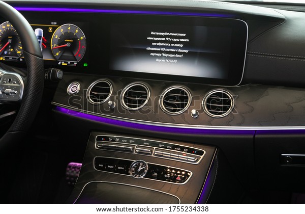 Novosibirsk/ Russia – April 28, 2020:\
Mercedes-Benz E-class, close-up of the central control panel,\
monitor with music and radio , adjustment of the blower, air\
conditioner, player.modern car\
interior