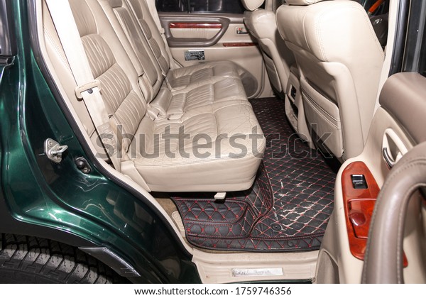 Novosibirsk/ Russia – April 28, 2020: Toyota\
Land Cruiser 100, close-up of the beige  rear seats with seats\
belt. modern car\
interior\
