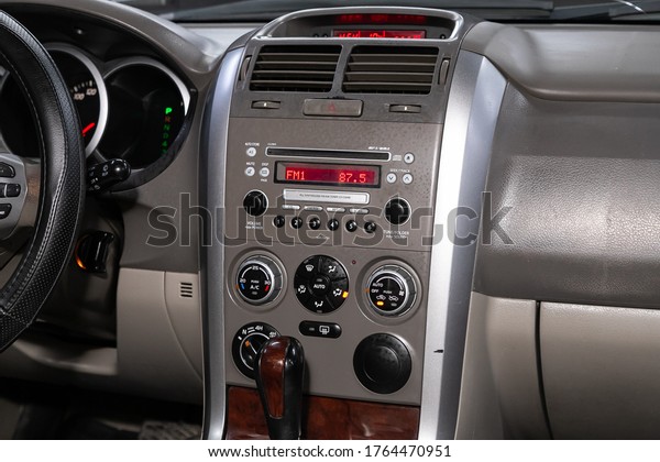 Novosibirsk/ Russia – April 28 2020: Suzuki\
Grand Vitara, close-up of the central control panel, monitor with\
music and radio , adjustment of the blower, air conditioner,\
player. modern car\
interior\
