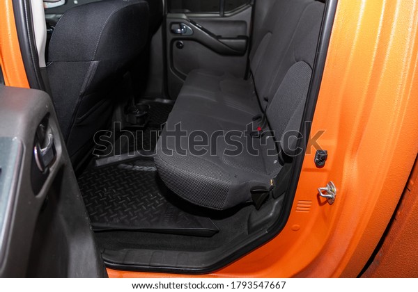 Novosibirsk/ Russia\
– August 01 2020: Nissan Navara, Rear seat for passengers in black\
textile. Comfort car\
inside.\
