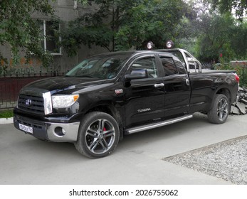 Novosibirsk, Russia, August 02 2013: Private Black Metallic Color Japanese Usdm Us Usa Pick-up Truck Car SUV Old Toyota Tundra Long Base Frame Crossover Import Export Made In USA Parking City Street