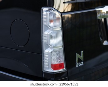 Novosibirsk, Russia -   August 03, 2022:   Honda N-Box,  Back Of A  Black Car:  Bumper, Trunk Lid, Taillight 