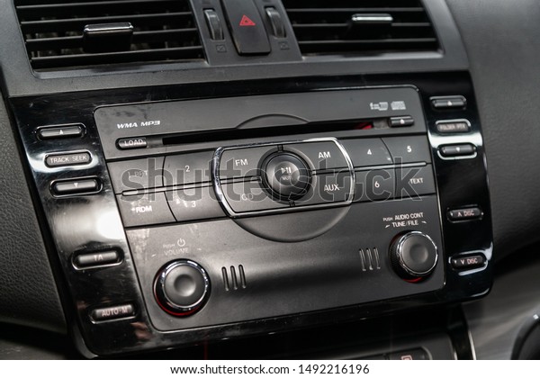 Novosibirsk, Russia – August 19, 2019: Mazda 6,\
Modern black car interior: radio, audio system with monitor  and\
control buttons\
