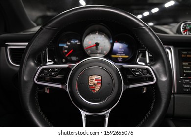 Novosibirsk, Russia – December 06, 2019:  Porsche Macan,  New Car Interior - Dashboard, Player, Steering Wheel With Logo And Buttons, Speedometer And Tachometer

