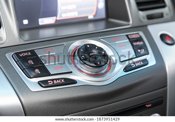 Novosibirsk, Russia – December 12, 2020: Nissan\
Murano, close-up of the central control panel, monitor with music\
and radio , adjustment of the blower, air conditioner, player.\
modern car\
interior