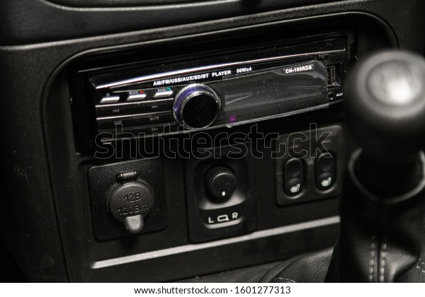 Novosibirsk, Russia – December 21, 2019:  Lada Niva,
Audio stereo system, control panel, charging in the car  and radio
in a modern car