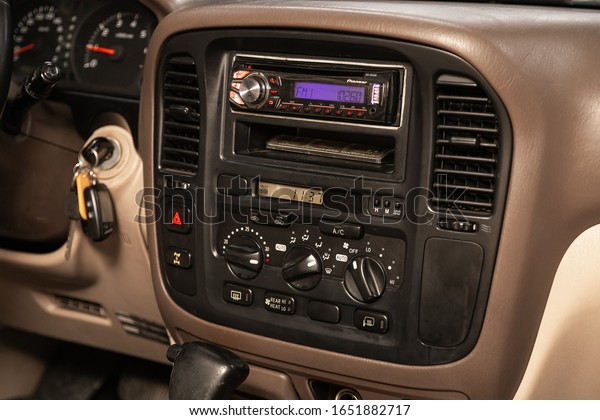 Novosibirsk, Russia – December 21, 2019:   Toyota\
Land Cruiser 100,  close-up of the central control panel, monitor\
with music and radio , adjustment of the blower, air conditioner,\
player. modern car
