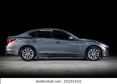 Novosibirsk, Russia - February 10, 2019:   Infinity Q50, Side View. Photography Of A Modern Car  On A Parking In Novosibirsk Against A Black Wall