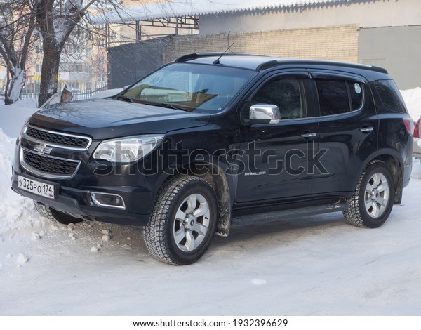 Novosibirsk, Russia - February 11\
2021: private all-wheel drive black metallic big frame SUV car\
Chevrolet TrailBlazer, Chevy crossover parking on winter snow\
street