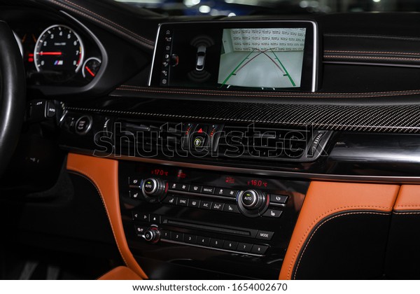 Novosibirsk,\
Russia – February 12, 2020: BMW X6, close-up of the central control\
panel, monitor with music and radio , adjustment of the blower, air\
conditioner, player. modern car\
interior\
