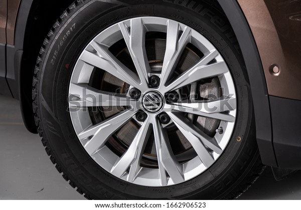 Novosibirsk, Russia – February 12, 2020: \
Volkswagen Tiguan, Car wheel with alloy wheel and new rubber on a\
car closeup. Wheel tuning\
disc\
\
