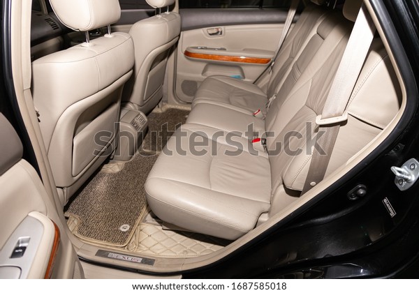 Novosibirsk, Russia – February 15, 2020 \
Lexus RX350,  close-up of the beige  leather  rear seats with seats\
belt. modern car\
interior\
\
