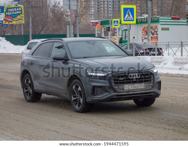 Novosibirsk, Russia - February 16 2021: private\
all-wheel drive dark gray color germany sport coupe crossover 4 wd\
Audi Q8 S Line Quattro , luxury car from Germany driving on winter\
snow street