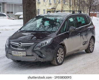 Novosibirsk, Russia - February 24 2020: Private Black Metallic Color Passenger Germany Minivan Car Opel Zafira, Station Wagon Van Mini Bus Export From Europe Parking The Snow Winter Street