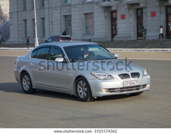 Novosibirsk, Russia - fubruary\
5 2021: private silver gray metallic color luxury germany\
rear-wheel drive sedan BMW 5-Series E60 525i, car from 2000s on the\
winter street