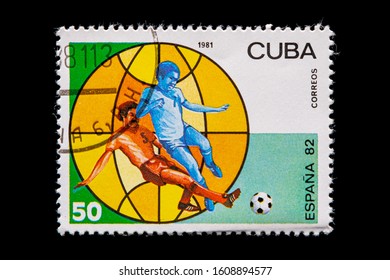 Novosibirsk, Russia - January 07, 2020: stamp printed in Cuba shows how football players play football, a postage stamp in honor of the 1982 soccer championship in Spain, circa 1981