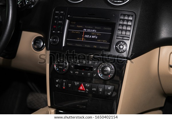 Novosibirsk, Russia –  January 14, 2020:  Mercedes-Benz\
GL-class , close-up of the central control panel, monitor with\
music and radio , adjustment of the blower, air conditioner,\
player. 