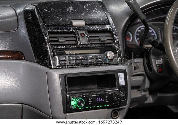 Novosibirsk, Russia – January 31, 2020: \
Nissan Presage,  close-up of the central control panel, monitor\
with music and radio , adjustment of the blower, air conditioner,\
player. modern car\
interior\
