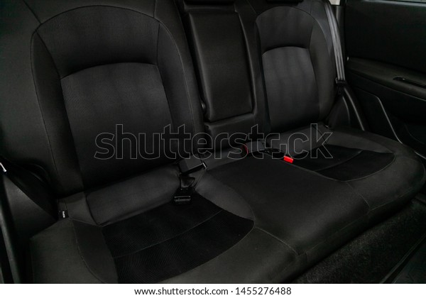 Novosibirsk, Russia – July 08, 2019: Nissan\
Quashqai, close-up of the black  rear seats with seats belt. modern\
car interior\
