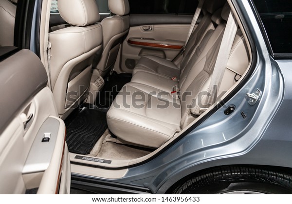 Novosibirsk, Russia – July 08, 2019: blue\
Lexus RX-350, close-up of the beige leather rear seats with seats\
belt. modern car\
interior\
