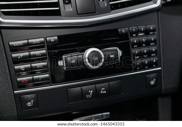 Novosibirsk, Russia –\
July 09, 2019: Mercedes Benz E-Class, Car control panel of audio\
player and other devices\
.A shallow depth of field close up of the\
control panel of a car.\
