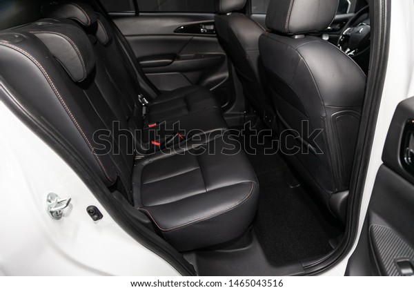 Novosibirsk, Russia – July 09, 2019:\
Mitsubishi Eclipse Cross, close-up of the black leather rear seats\
with seats belt. modern car\
interior\
