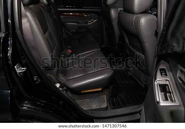 Novosibirsk, Russia – July 12, 2019:  Toyota\
Land Cruiser Prado,  close-up of the  gray leather  rear seats with\
seats belt. modern car\
interior\
