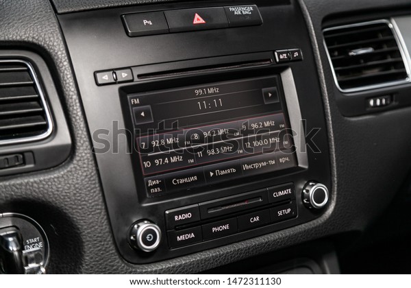 Novosibirsk, Russia –\
July 17, 2019:  Volkswagen Touareg, Car control panel of audio\
player and other devices\
.A shallow depth of field close up of the\
control panel of a car.\
