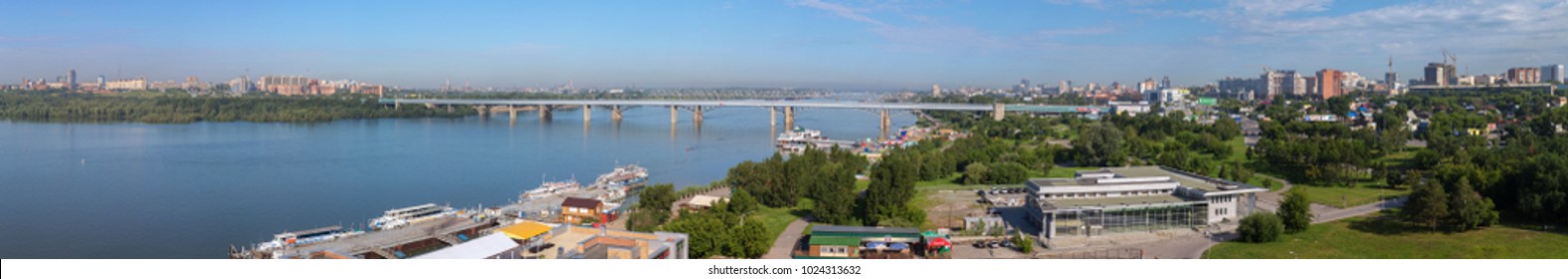 Novosibirsk, Russia - July 20, 2013: Panorama of summer Novosibirsk Octyabrsky bridge across the river Ob