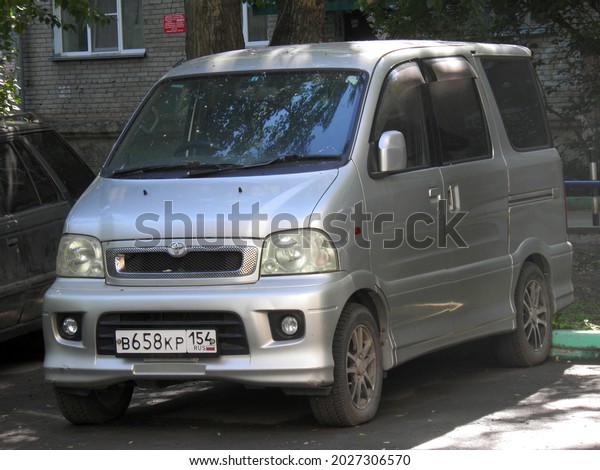 Novosibirsk, Russia - July 20 2018: private silver gray\
metallic compact japanese passenger minivan Toyota Sparky (Daihatsu\
Hijet, Atrai 7), rare mini van bus key car made in Japan on urban\
street 