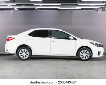 Novosibirsk, Russia - July 21, 2021: white Toyota Corolla,  side view. Popular car on a parking
