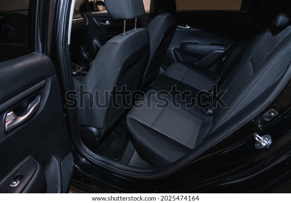 Novosibirsk, Russia -\
July 21, 2021: Kia Rio ,  Rear seat for passengers in black \
textile. Comfort car\
inside.