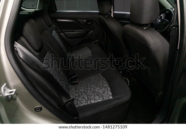 Novosibirsk,\
Russia – July 31, 2019:  LADA XRAY\
, close-up of the black  rear\
seats with seats belt. modern car\
interior\
