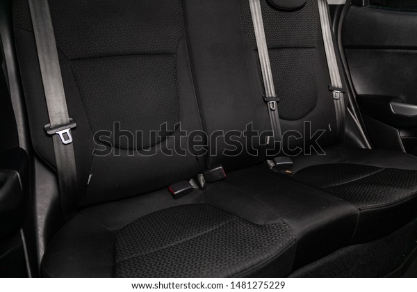 Novosibirsk,\
Russia – July 31, 2019:  Kia Rio, close-up of the black  rear seats\
with seats belt. modern car\
interior\
