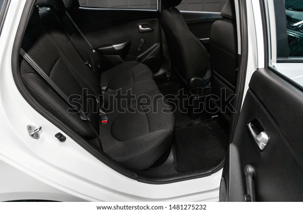 Novosibirsk,\
Russia – July 31, 2019:  Kia Rio, close-up of the black  rear seats\
with seats belt. modern car\
interior\
