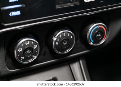 Novosibirsk, Russia – July 31, 2019:Toyota Corolla. Modern black car interior: climat control view with air conditioning button  