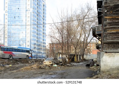 Novosibirsk, Russia - June 03, 2016:an Old Woman Sitting In A Crumbling House In The City With A Dog And A Cat In Novosibirsk, 03 Jun 2016.