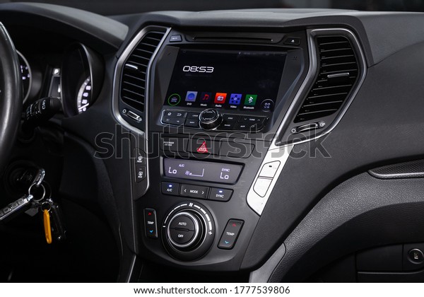 Novosibirsk/ Russia –\
June 03 2020: Hyundai Santa Fe, close-up of the central control\
panel, monitor with music and radio , adjustment of the blower, air\
conditioner, player.\
